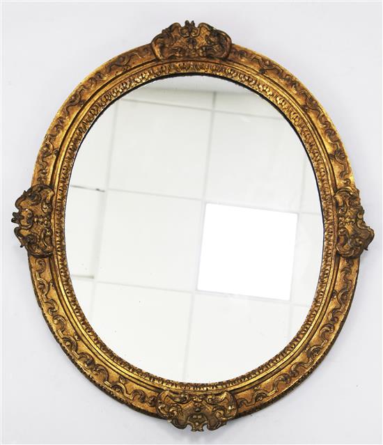 A Victorian oval giltwood and gesso wall mirror, W.2ft 6in. H.3ft 1in.